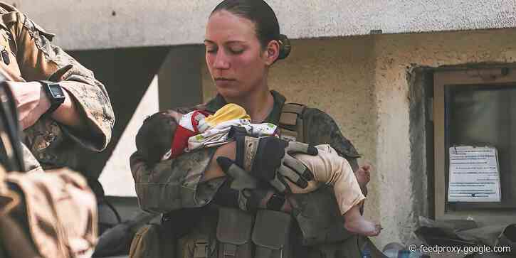 A marine killed in Kabul attack was pictured cradling baby at the airport in one of her last social media posts