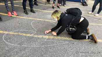 Hundreds of broken hearts drawn in chalk on Calgary streets to remember drug overdose victims