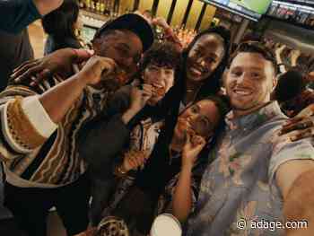 Buffalo Wild Wings’ football campaign puts crowded bars back on the marketing menu