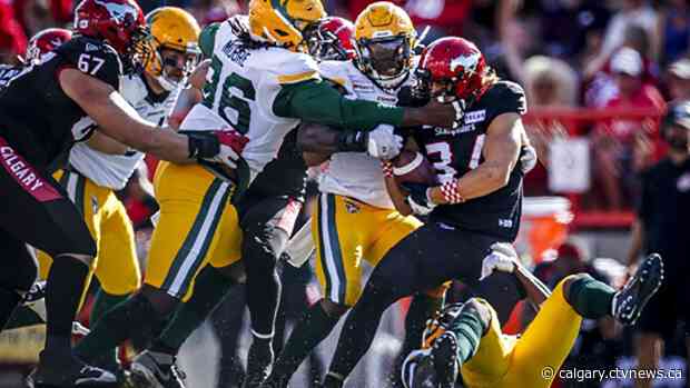 Harris throws four TD passes, leads Elks to 32-20 win over Stampeders