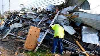 Ida-battered New Orleans cleans up trash as streets begin to stink