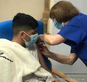 Praise as Husnain, 14, takes jab to protect his vulnerable dad