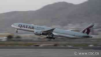 Some 200 foreigners, including 43 Canadians, fly out of Kabul on commercial flight
