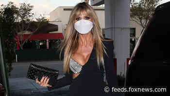 Heidi Klum puts on leggy display as she steps out for dinner in little black dress