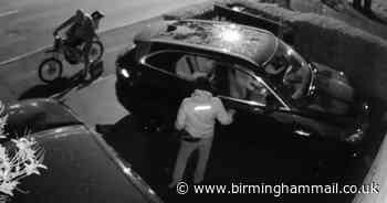 Watch as masked man rifles through BMW and Jaguar cars in Sutton Coldfield - Birmingham Live