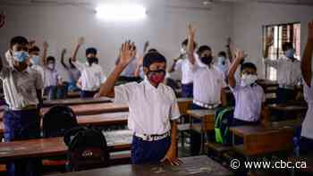 U.K. ditches planned COVID-19 vaccine passport; countries grapple with back-to-school plans