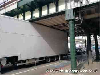 Balham station: Lorry strikes railway bridge