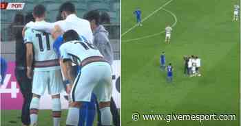 Man Utd's Bruno Fernandes surrounded by pitch invaders during Azerbaijan 0-3 Portugal - GIVEMESPORT