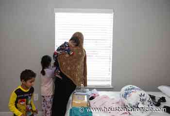 Afghan family arrives in Houston with newborn as questions loom about access to benefits - Houston Chronicle