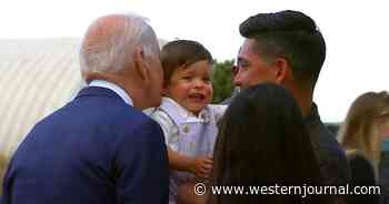 Watch: Biden Defies COVID Protocol, Appears to Scare Baby When He Leans In for Kiss