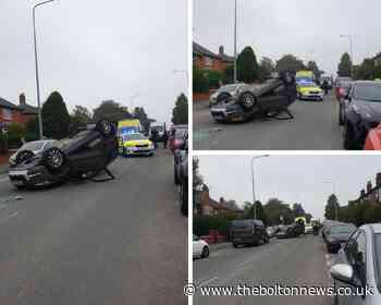 Bolton: Mum and daughter helped from overturned car on Hulton Lane