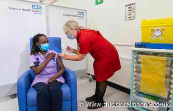 Croydon  hospital worker receives landmark Covid booster jab