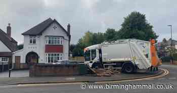 ‘Runaway’ bin lorry narrowly misses Sutton Coldfield dog walker before smashing into wall - Birmingham Live