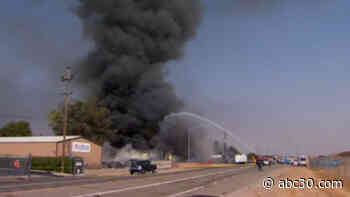Firefighters battling large building fire near Highway 41 in Madera County