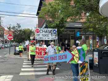 Climate Action Rhode Island takes on Thayer Street to protest JPMorgan Chase's funding of fossil fuels - The Brown Daily Herald