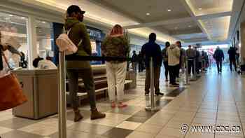 People stand in line for COVID-19 shot 1 day after Moe announces proof of vaccine program