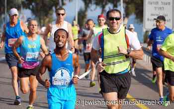 Blind Israeli runner takes on London Marathon to raise money for guide dogs - Jewish News