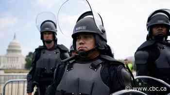 Sparse crowds protesting outside U.S. Capitol outnumbered by police