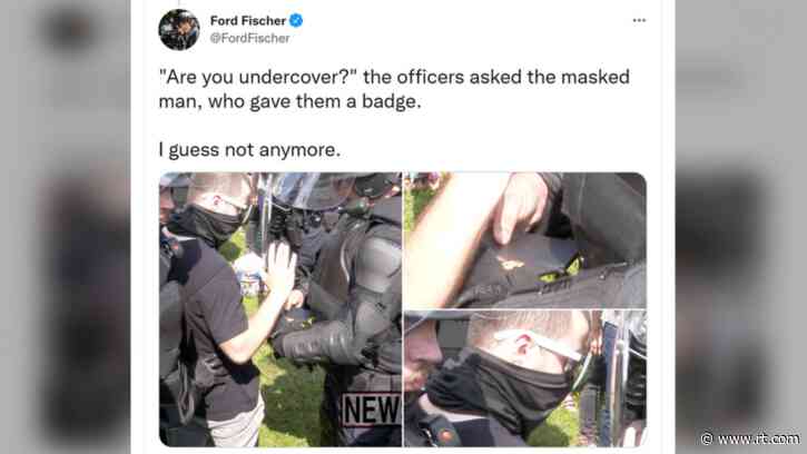 ‘Are you undercover?’ WATCH riot cops at Justice for J6 rally detain masked man with a GUN… and a badge?