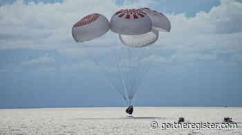 Space tourists splash down in Atlantic Ocean after three days in orbit