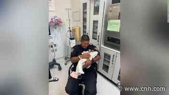 Officer catches a 1-month-old baby dropped from 2nd floor balcony, authorities say