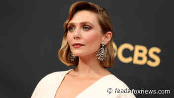 Elizabeth Olsen hits Emmys red carpet in dress designed by sisters Mary-Kate and Ashley Olsen