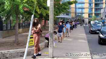 Long lineups form outside some polling stations across Toronto