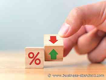 Retail depositors earning negative returns; relook taxes on interest: SBI - Business Standard