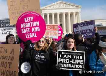 Biden administration urges Supreme Court to uphold Roe v. Wade
