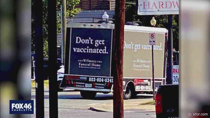 Rolling billboard with anti-vaccine message promoting 'funeral home' turns heads
