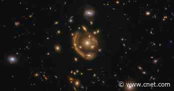 Gorgeous 'molten ring' galaxy spotted by Hubble reveals ancient star factory     - CNET