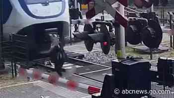 WATCH:  Woman narrowly escapes being hit by a train