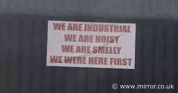Garage erects cheeky sign warning new estate: 'We're smelly and were here first'