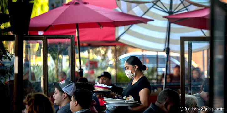 A 67-year-old Seattle drive-in chain is raising its minimum wage to $19 an hour and paying more overtime as it tries to triple its usual hiring