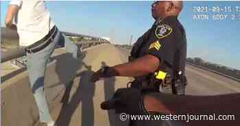 Watch: Police Officers Make Heroic Rescue of Suicidal Man on Bridge