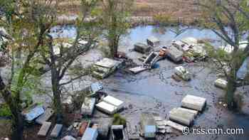 Caskets are still scattered around a Louisiana community a month after Hurricane Ida