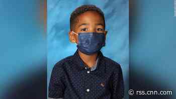 First grader wears mask for school picture because his mom told him not to take it off