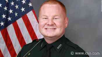 More than 300 people are involved in manhunt for a suspect after a Florida sheriff's deputy was shot during a traffic stop