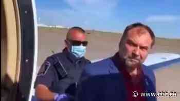 Controversial preacher arrested on Calgary tarmac for warrants after U.S. anti-vaxx speaking tour