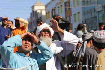 Witness: Taliban hang dead body in Afghan city’s main square