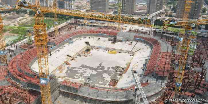 Beleaguered real-estate giant Evergrande's $1.8 billion lotus-shaped soccer stadium is partially built and in shambles amid the company's impending collapse