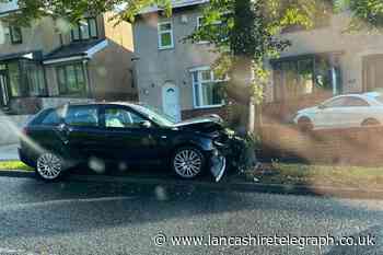 Vehicle smashes into tree on busy Blackburn road