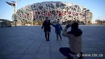 Beijing Olympics will allow spectators, IOC says