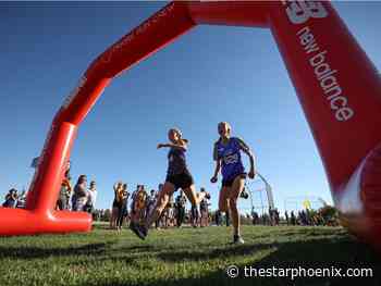 High school cross country athletes ready to cross the finish line at city championships