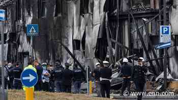 Small plane crashes into empty building outside Milan, all 8 onboard die