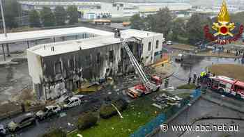 Light plane crashes into a Milan building, killing all eight passengers