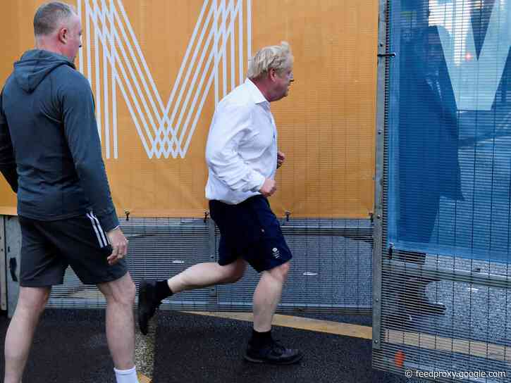 UK Prime Minister Boris Johnson begins major political conference with a jog wearing a formal shirt and dress shoes