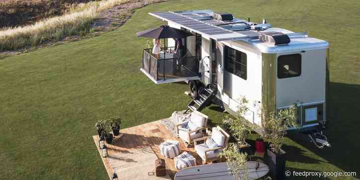 A luxury travel trailer maker unveiled its latest $250,000 model that can charge EVs - see inside the 2022 Living Vehicle
