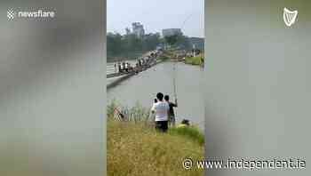 Collapsed bridge causes dozens to fall into river in China - Independent.ie