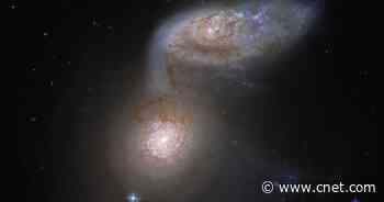 Hubble telescope captures galaxies locked in 'a dangerous dance'     - CNET